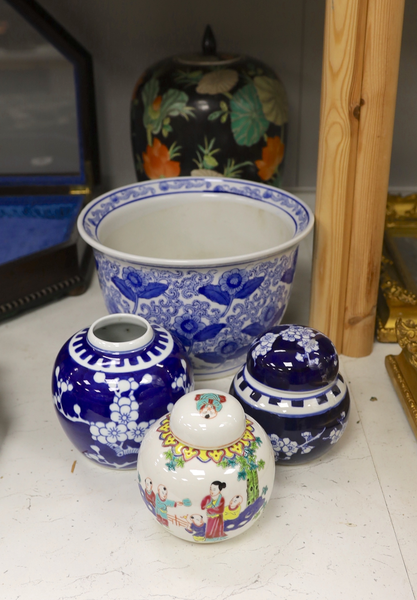 A Chinese famille noire vase and cover, three ginger jars and a jardiniere, largest 33cm